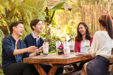 Group of friends hang out in cafe have fun together