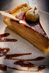 piece of apple pie, decorated with baked apples