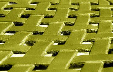 Part of metal construction pattern in yellow tone.