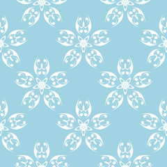 White flowers on blue background. Ornamental seamless pattern