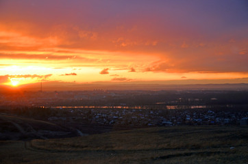 A bright sunrise over a provincial town.