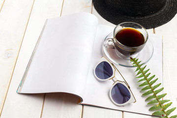 Mock-up magazine or catalog on a wooden table.