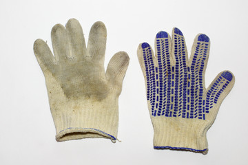 a pair of dirty gloves for gardening. dotted anti-skid surface. elastic cuff. blue hem. from both sides