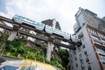 chongqing,china - may,21,2018:The train going through the building,this place is tourism point in...