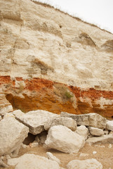 Quarry white stones near beach. Incredible rock formations. Backgrounds and textures. Vertical image.