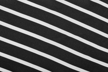 Black and white stripes. Striped black and white textile pattern as a background. Close up on vertical stripes material texture fabric.