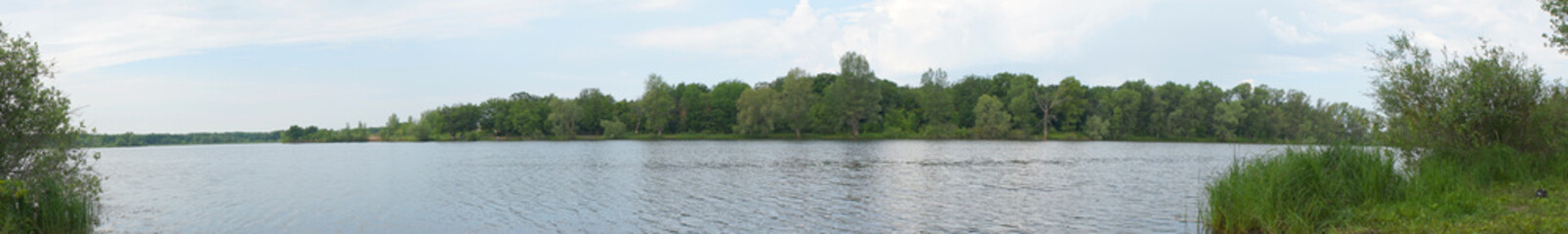 Fototapeta na wymiar Lake with a forest on the opposite shore
