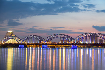 Railway Bridge with national library at sunset twilight in Riga, Latvia
