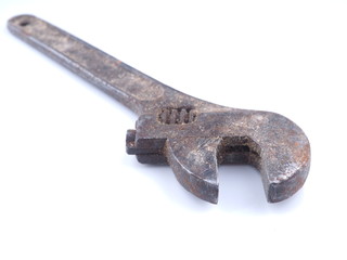 old adjustable wrench on white background