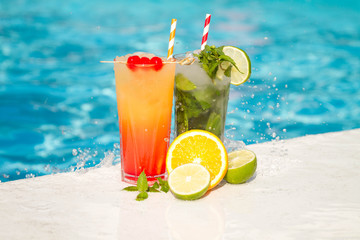 Tropical cocktail on a pool background