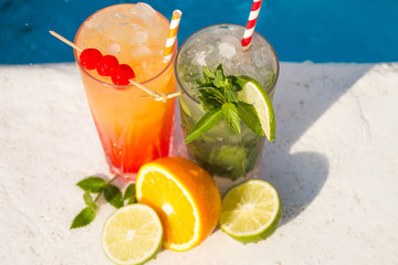Tropical cocktail on a pool background