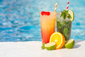 Tropical cocktail on a pool background