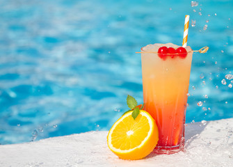 tropical cocktail on a pool background