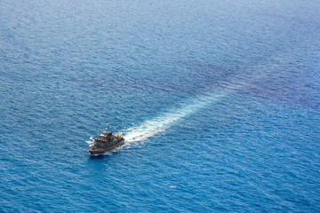 Fototapeta premium Military navy ships in a sea bay view from helicopter