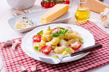 delicious gnocchi with gorgonzola cream sauce and cherry tomatoes