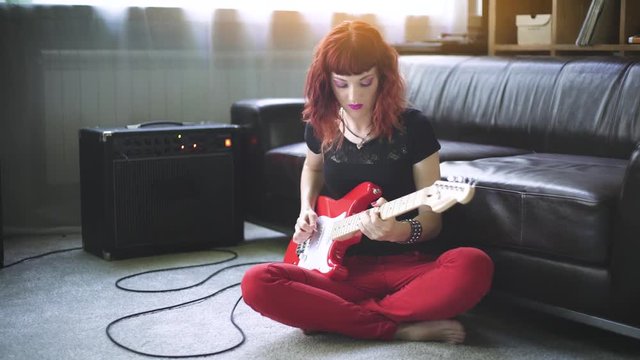 Girl playing electric guitar