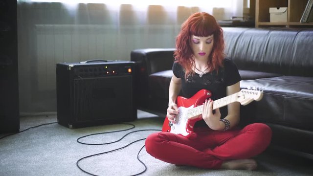Girl playing electric guitar