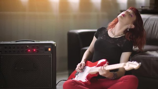 Girl playing electric guitar