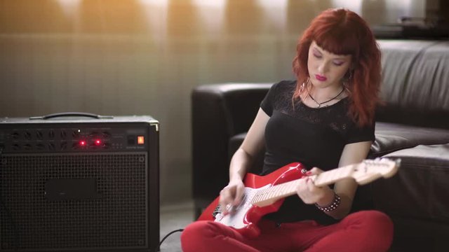 Girl playing electric guitar