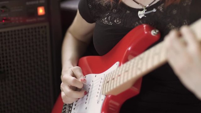 Girl playing electric guitar