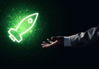 Man palm presenting Rocket web icon as technology concept