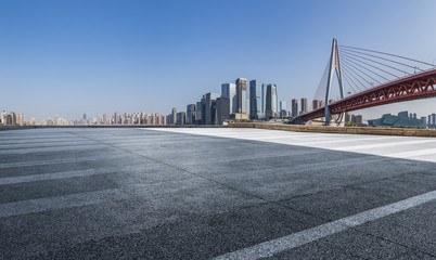 Fototapeta premium Panoramic skyline and modern business office buildings with empty road,empty concrete square floor
