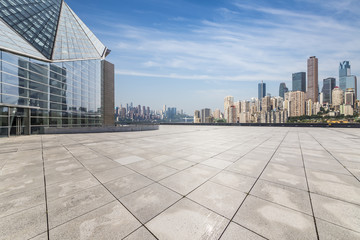 Fototapeta premium Panoramic skyline and modern business office buildings with empty road,empty concrete square floor