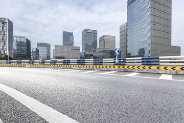 Fototapeta premium Panoramic skyline and modern business office buildings with empty road,empty concrete square floor