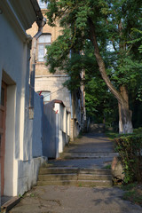 Fototapeta na wymiar Old narrow streets with ancient buildings at sunset in Pyatigorsk, Russia
