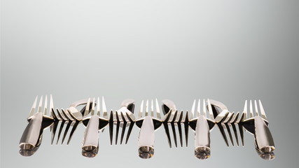 Bronze forks decoration arrangment in a row on reflection surface and background, isolated with clipping path
