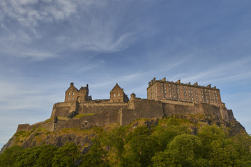 Fototapeta na wymiar Ancient Edinburgh Castle on rocky mountain with beautiful sky background, Scotland, United Kingdom.