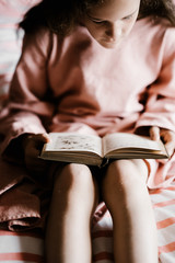 Fototapeta na wymiar Child reading a bedtime story book