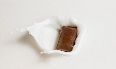 Chocolate falls in milk