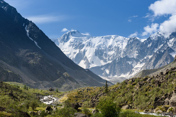 A view of the Belukha mountain from the valley of the Akkem River. Summer, good weather, snow tops.
