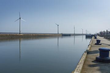 Wind farm on a Harbour wall, on the North East coast