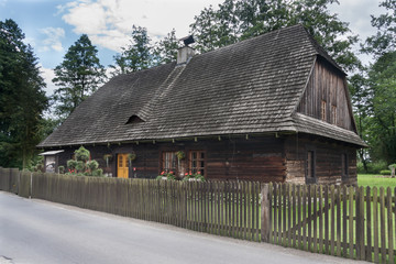Fototapeta na wymiar An antique wooden cottage with a log construction without remnants from 1831. Village Kielcza, Opole province, Poland, Europe.