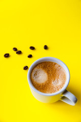 Cup of espresso and coffee beans