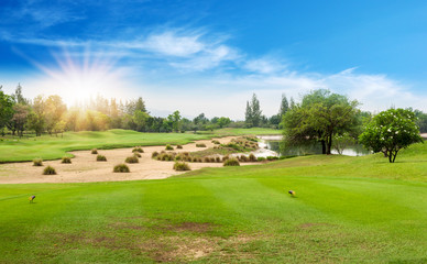 Beautiful landscape of golf course in the countryside in sunset, sunrise time. Asia, Thailand.