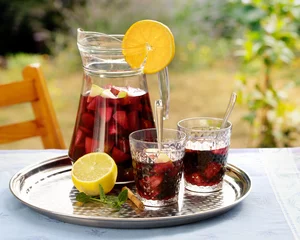 Foto auf Acrylglas Refreshing homemade sangria with summer fruits in pitcher and glasses © rgvc