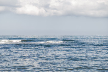 View of the sea, waves and calm wind.