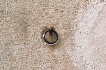 Metal door ring on the wall. Head Knocker