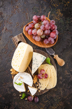 Cheese with nuts and grapes