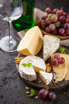 Cheese with nuts and grapes