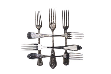 Collection of antique forks over white background