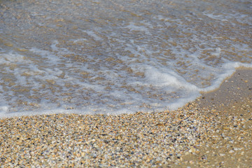 Lake Water Surface with Small Waves on Warm Sunny Bright Summer Day with No People. Lake Shore Water Background near Coastal Line with Sun Reflections, Nature Scenic Seascape