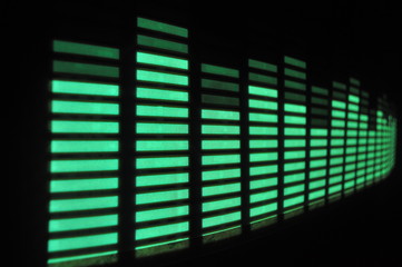 Yellow and green glowing light structure and graphic equalizer on a black background, splash screen