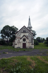 Old abandoned church against dramatic dark sky