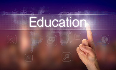 A hand selecting a Education business concept on a clear screen with a colorful blurred background.
