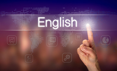 A hand selecting a English business concept on a clear screen with a colorful blurred background.