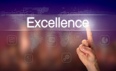 A hand selecting a Excellence business concept on a clear screen with a colorful blurred background.
